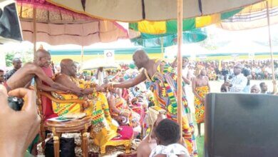 Osagyefo Amoatia Ofori Panin (seated), the Okyenhene, exchanging pleasantries with Daasebre Dr Twum Ampofo, Asiakwahene